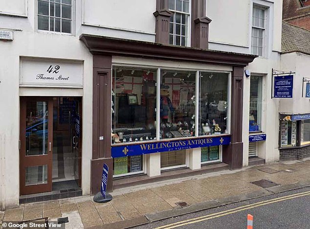 John Wellington was ordered to pay £55,000 to sales assistant Audrey Pereira over remarks he made after she started working at Wellington Antiques in Windsor (pictured)