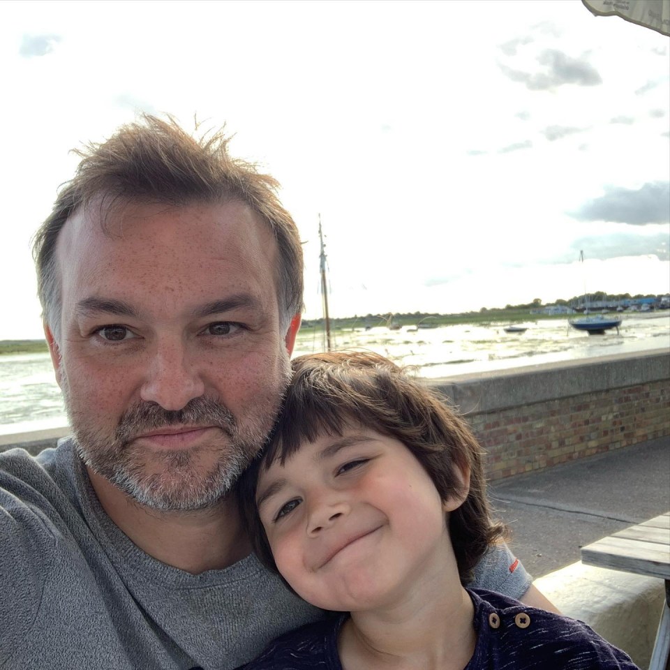 A father and son hugging and smiling, the dad has pancreatic cancer and has been given a few months to live.