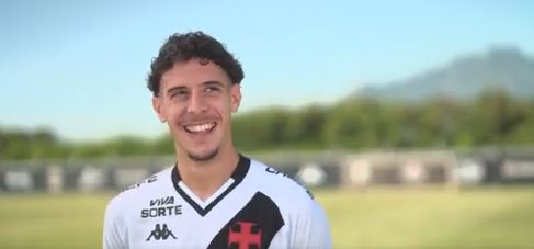 Smiling soccer player in uniform.
