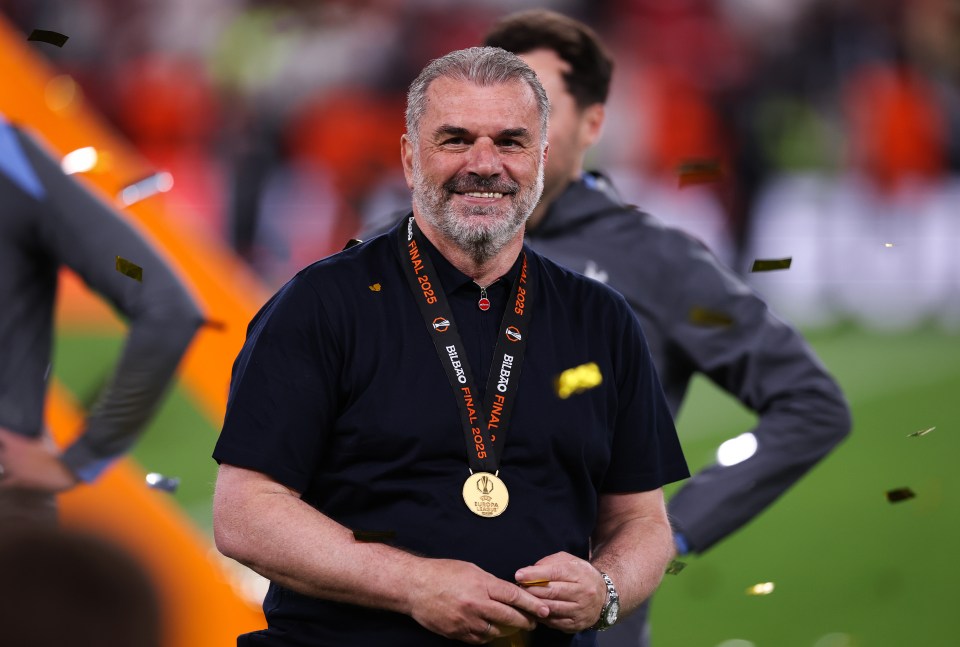 Ange Postecoglou, Tottenham Hotspur manager, celebrating with a Europa League medal.