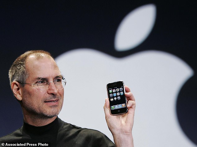 Apple CEO Steve Jobs holds up an Apple iPhone at the MacWorld Conference in San Francisco, in this Jan. 9, 2007 file photo