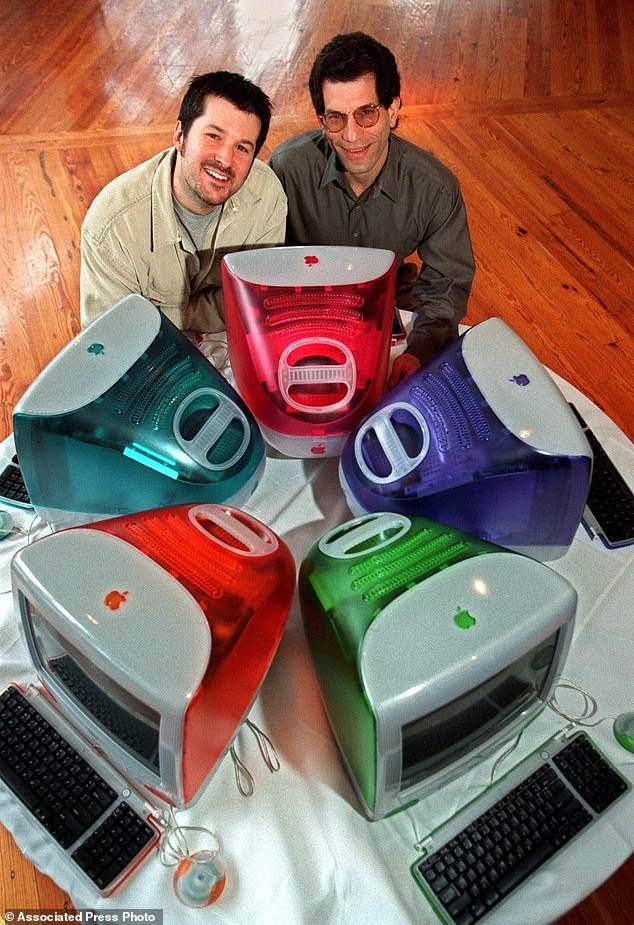 This March 19, 1999 file photo shows Jonathan Ive, left, Apple Computer's vice president of design, and Jon Rubinstein, Apple's senior vice president of engineering, posing behind five iMac personal computers at Apple headquarters in Cupertino
