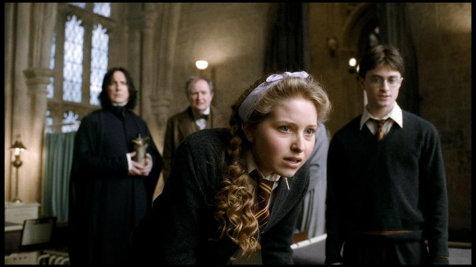 Scene from Harry Potter and the Half-Blood Prince showing Harry Potter, Ginny Weasley, Severus Snape, and Horace Slughorn.