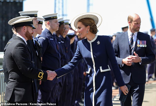 The Princess appeared relaxed as she met staff (pictured) at the naming ceremony for the warship