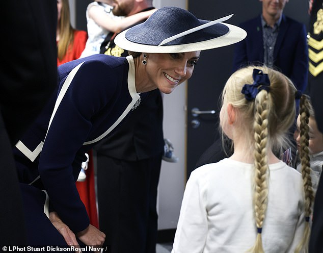 The Princess meets the Ship's company and their families at the official naming ceremony