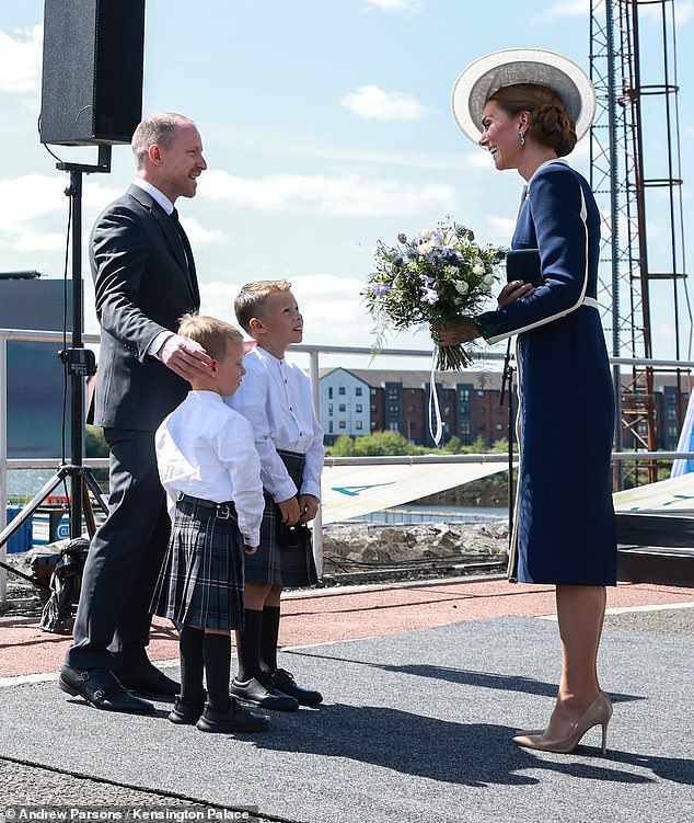 The Princess of Wales (pictured right at the event today) has officially named HMS Glasgow by smashing a bottle of local Scottish whisky against its hull