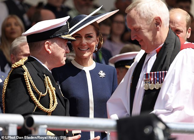 Stepping up onto a podium before a crowd of several hundred BAE employees, their families and the 45-strong ship's company, Kate (pictured centre) uttered the time-honoured words: 'I have the pleasure to name this ship HMS Glasgow, may God bless her and all who sail on her'