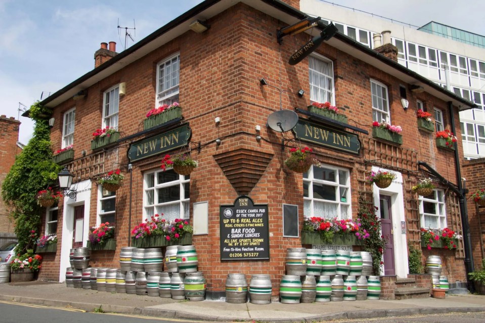 The New Inn pub, with beer kegs outside.