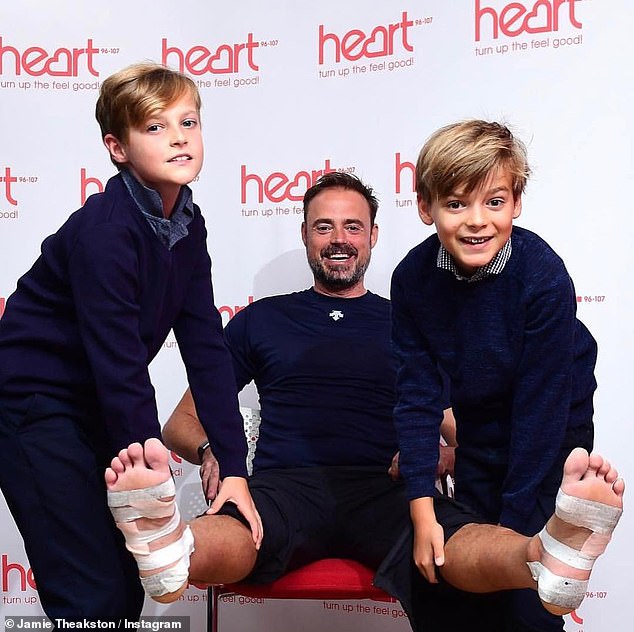 The Heart Breakfast host said he was so blindsided by the news he worked hard to 'suppress it' in order to enjoy the trip with their sons Sidney, 17, and Kit, 16 (pictured with his sons in 2018)