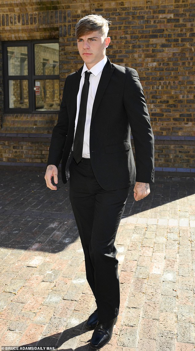 He was pictured in a black suit ahead of the sentencing