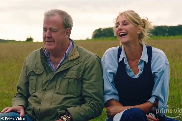 The TV host has since lost almost two stone and is sporting a slimmer, healthier look, but still his girlfriend Lisa Hogan has 'given up' on making him look good (pictured together)
