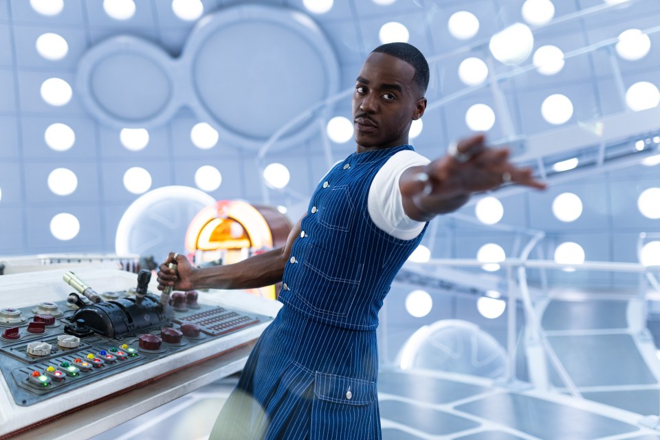 Ncuti Gatwa as the Doctor operating the TARDIS console.