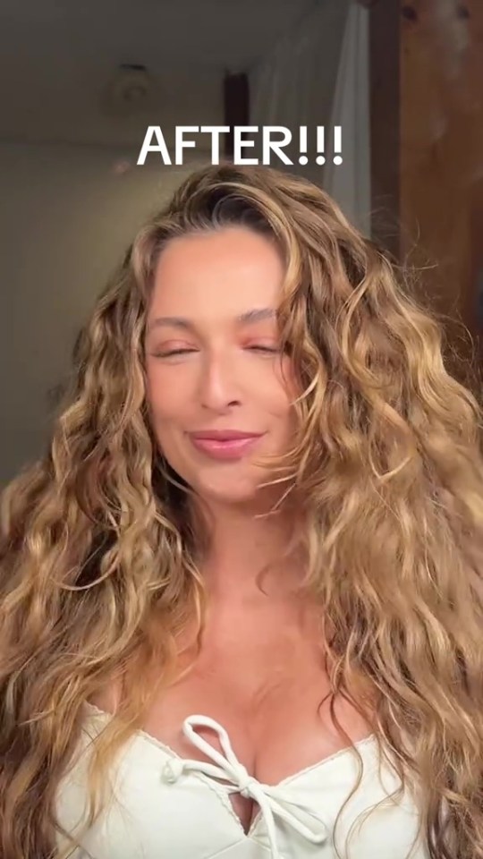 Woman with long curly blonde hair after a hair makeover.