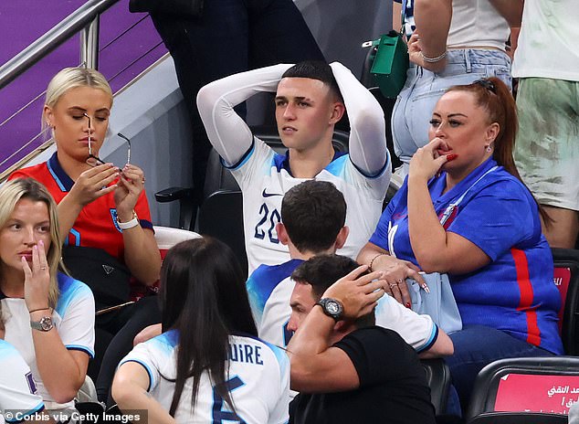 Foden with mother Claire (right) and girlfriend Rebecca (in red) at the 2022 World Cup