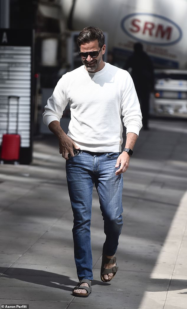 After Helen made her exit from the studio, Gethin, 47, was seen leaving in a white jumper paired with jeans and Birkenstocks