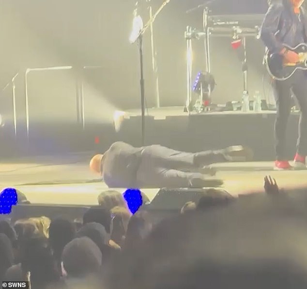 Billy was performing his song It's Still Rock and Roll to Me when he stumbled backwards and fell on his back, prompting gasps from the audience