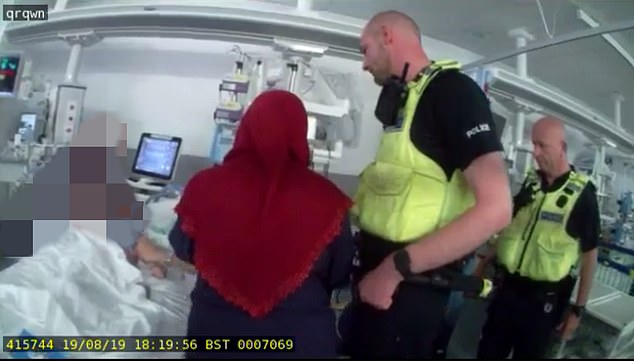In the video, Aliya turns to the tallest of the officers to beg for empathy for her grief, asking: ‘Do you have children?’. He says yes