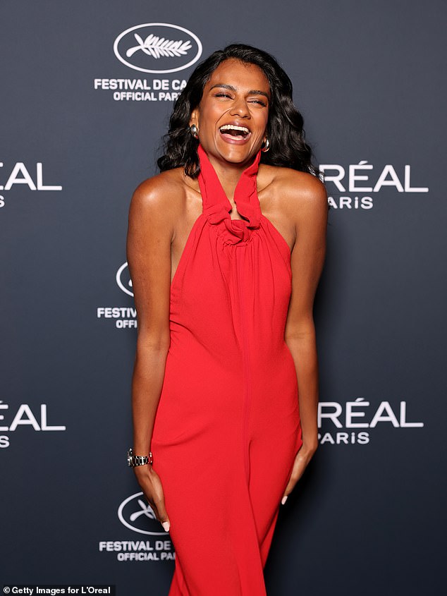 Her figure-hugging dress featured a halterneck design and was adorned with ruching
