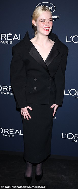 American actress Elle Fanning was also in attendance, as she arrived in a quirky oversized double-breasted suit-style gown