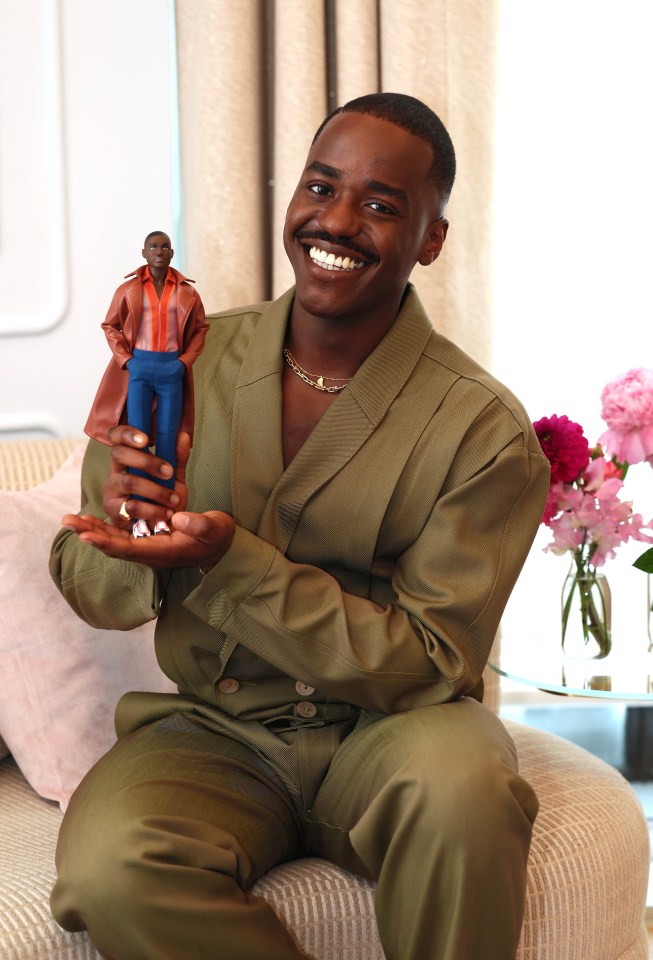 Ncuti Gatwa holding his Doctor Who Barbie doll.