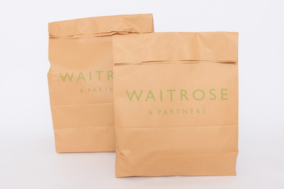 Two Waitrose & Partners paper bags.
