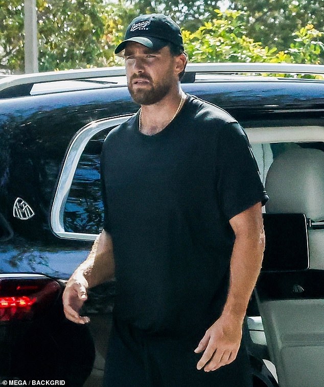 Kelce went to the backseat of his car to change shirts after the intense workout in the sun