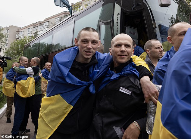 Ukrainian prisoners of war get off a bus after arriving in Ukraine on May 6, 2025 in Chernihiv, Ukraine