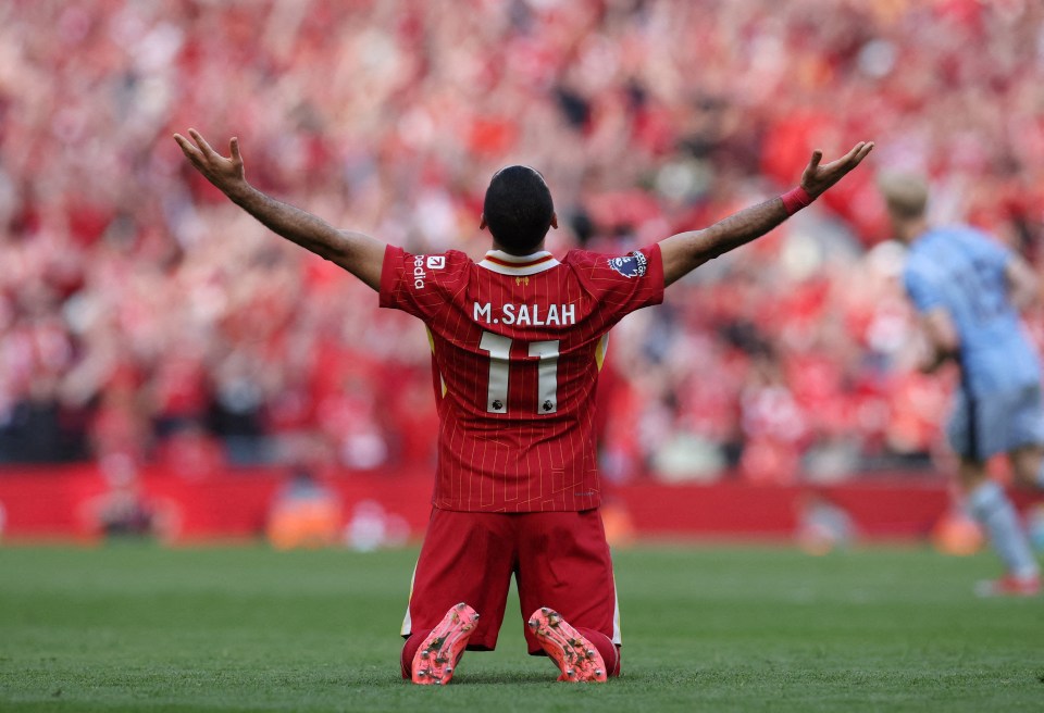Mohamed Salah celebrates on his knees after a soccer game.