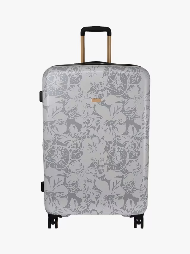 Grey floral-patterned suitcase on wheels.