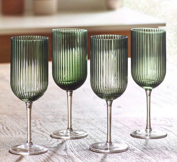 Four ribbed green glasses.