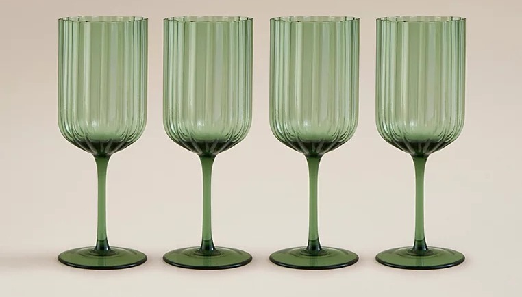 Four green ribbed glasses.