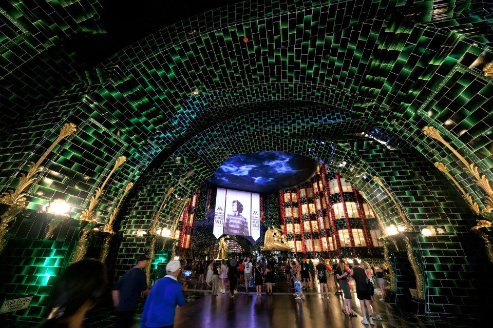 Visitors at the Ministry of Magic entrance in Universal's Epic Universe theme park.