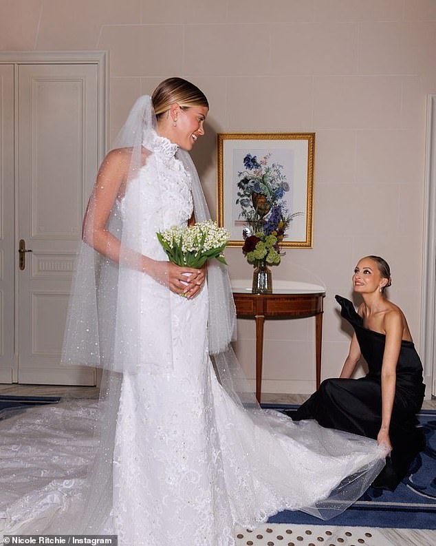 Sofia Ritchie's short but chic custom Chanel dewdrop veil was adorned with resin water droplets to create a sparkling effect as she walked down the aisle towards her husband, Elliot Grainge at their wedding in 2023