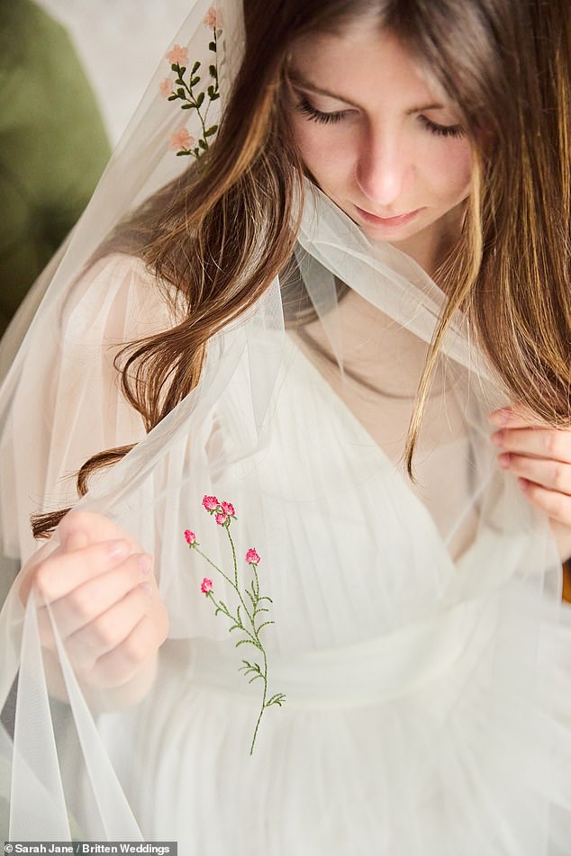 Embroidering flowers is a popular way of incorporating colour into an otherwise all-white bridal look