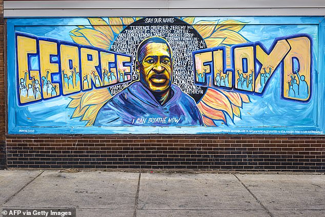 A mural honoring George Floyd is seen on a wall nearly five years after his killing by Minneapolis police, painted with the words "I CAN BREATHE NOW" and surrounded by names of other victims of police violence in Minneapolis, Minnesota on May 19, 2025
