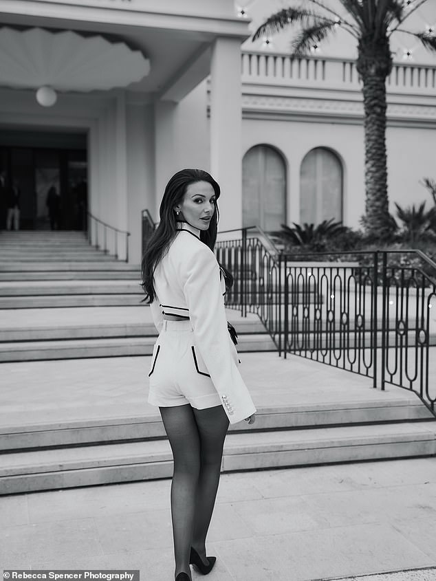 Michelle, who is in Cannes with L'Oreal, struck a pose in her stunning ensemble
