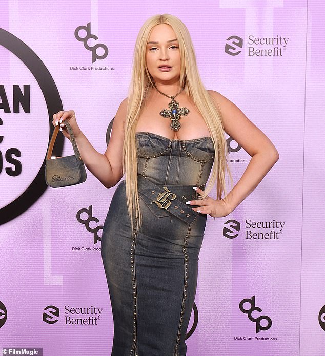 Kim Petras, 32, wore an all-denim outfit in 2022 that wasn't flattering. The studded jean look flared out with a mermaid train, and Kim paired it with a chunky jean belt