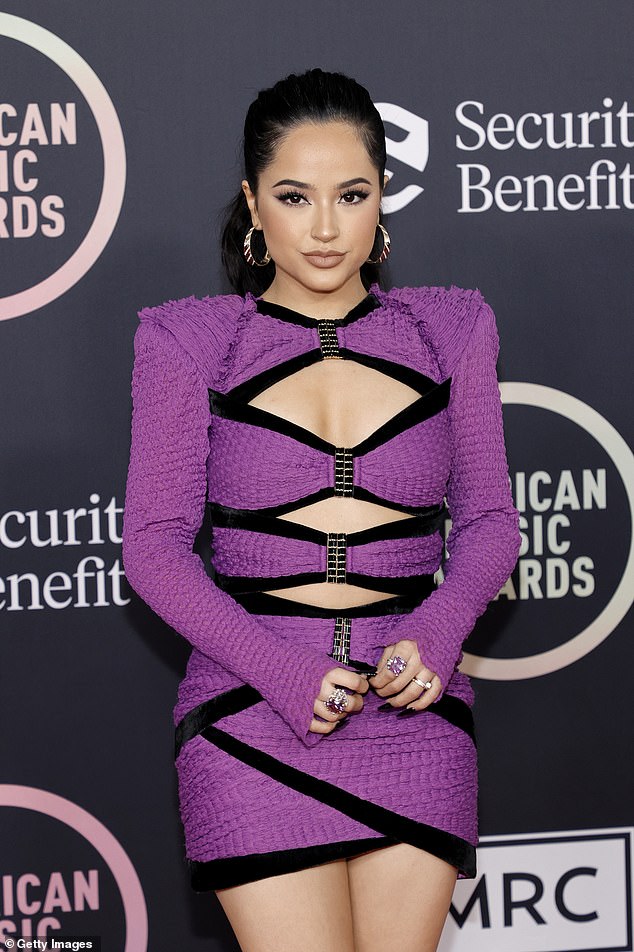 Becky G donned a semi-80s frilled purple mini dress with black trimming and shoulder pads in 2021