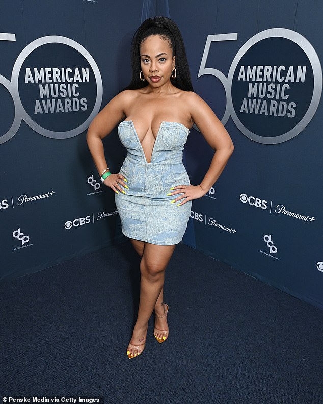 Television personality Ajani Scott also stood out on the carpet - but not for the reason she was hoping for