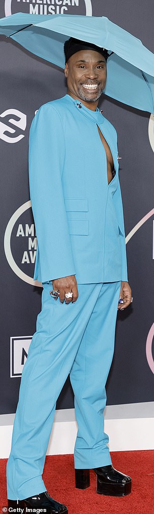 He completed the look with a large umbrella hat