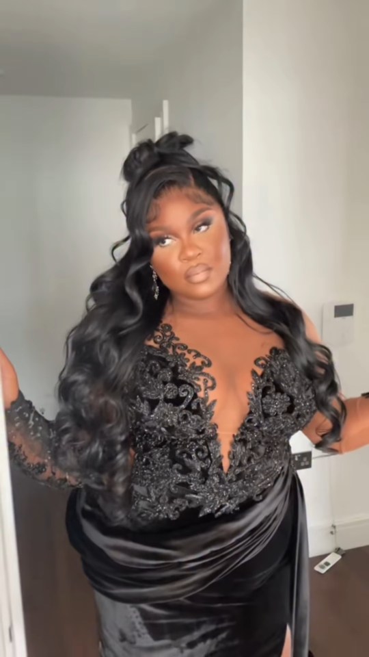 Nella Rose in a black, embellished gown.