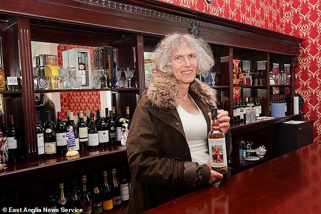 Ms Kane behind the bar at Carbisdale Castle. She was restoring it at a reported cost of £10million and plans to welcome paying guests