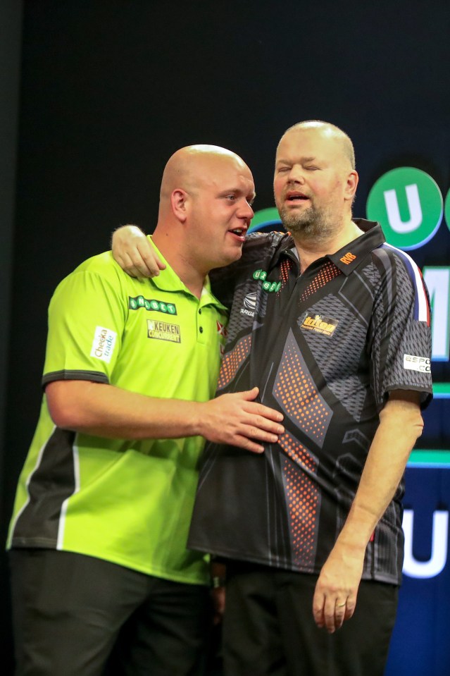 Michael van Gerwen and Raymond van Barneveld after a darts match.