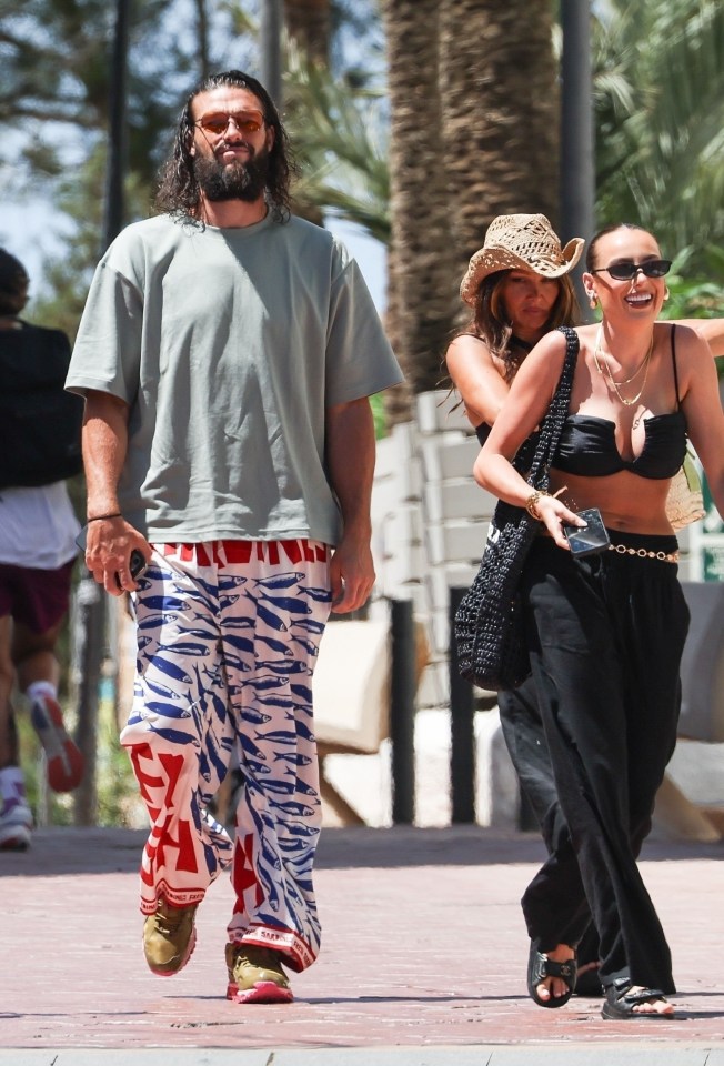 Andy Carroll and Lou Teasdale walking together in Ibiza.