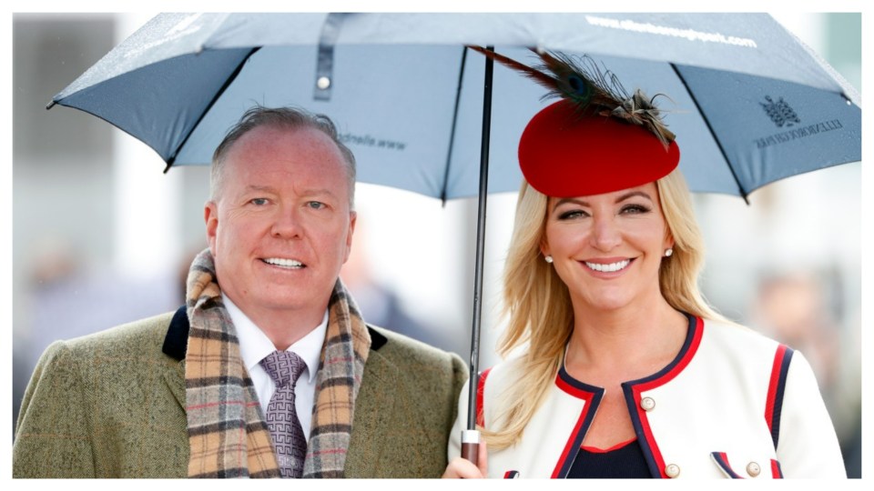 A man and woman standing under an umbrella.