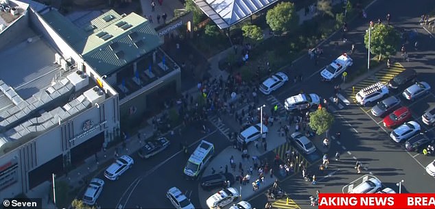 Dozens of emergency vehicles raced to the scene, with a nearby street littered with police cars and ambulances