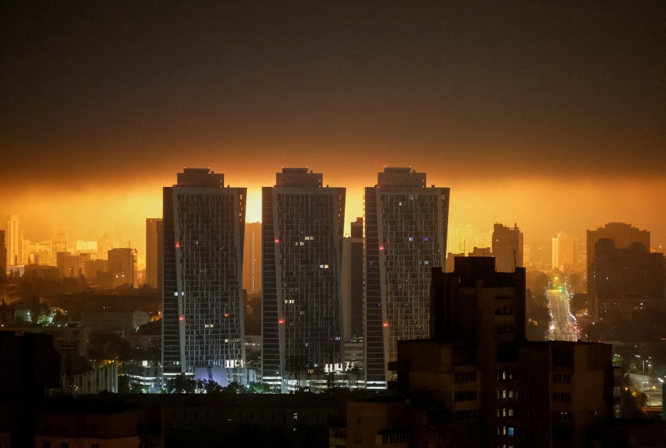 Drone explosion lights up Kyiv night sky.