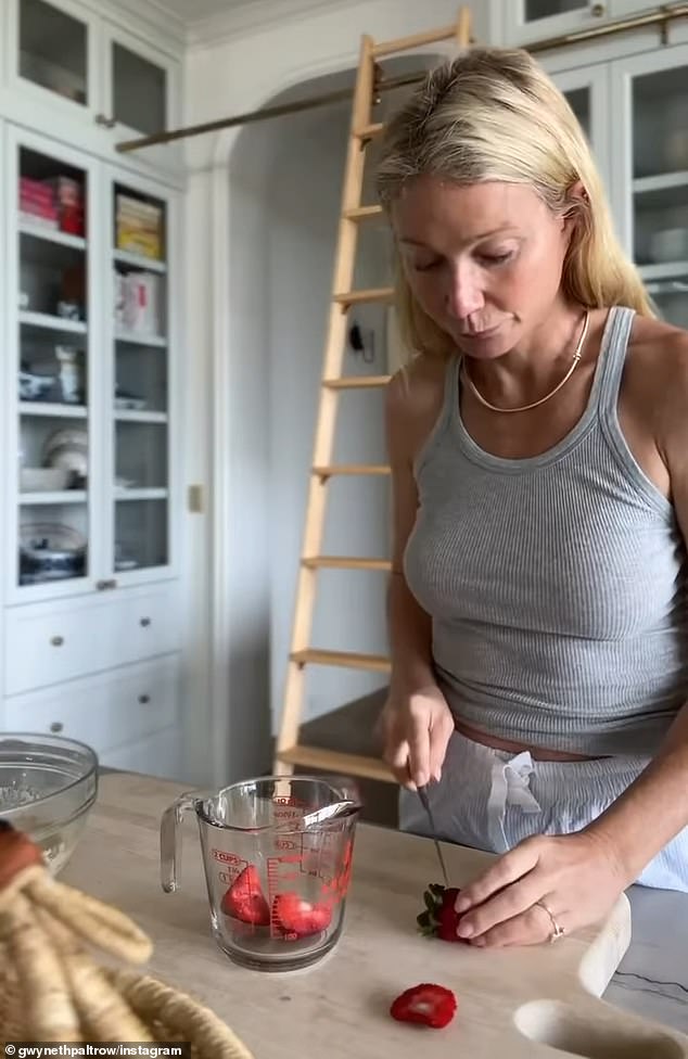 Paltrow kept it casual for the Instagram video, and donned a pair of comfy white shorts as well as a fitted, light gray tank top