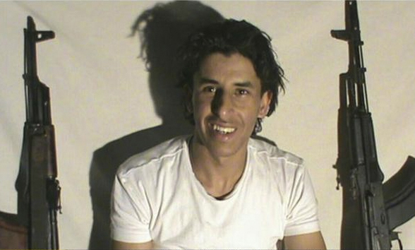 Photo of Seifeddine Rezgui with two rifles.