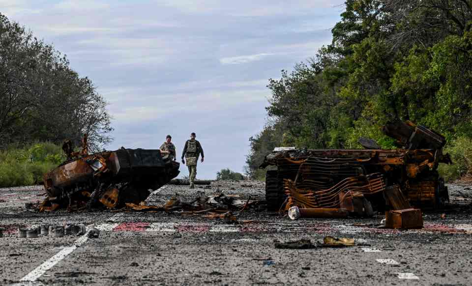 Destroyed armored vehicles on a road in Balakliya, Ukraine.
